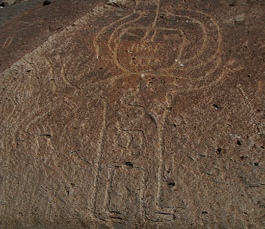strange figure of astronaut at Toro Muerto Petroglyphs